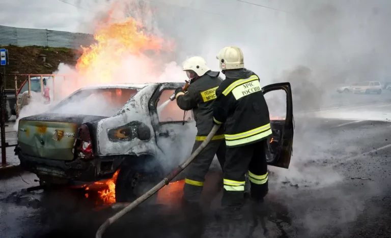 Fire brigade stop a fire and debate about causes of electric vehicle fire